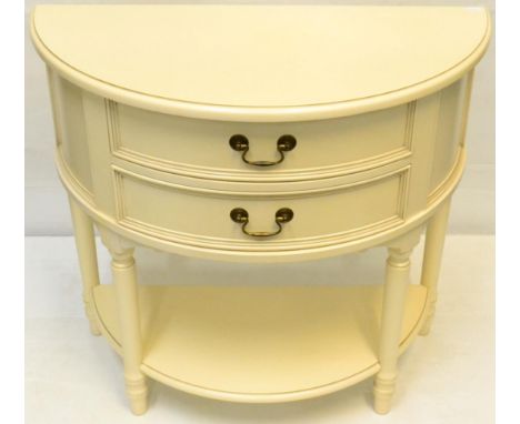 A Cream Painted D Shaped Two Drawer Chest of recent date, raised on turned legs adjoined by a shelf 84cm by 40cm by 78cm 