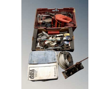 A collection of tools, chain saw, bench vice, hand tools etc 