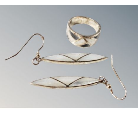 A silver ring and pair of earrings 