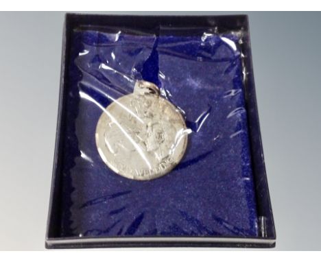 A silver Charles and Diana pendant