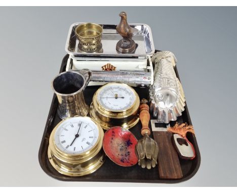 A brass cased barometer and similar quartz clock together with a group of metal wares including enamelled scales, jelly mould