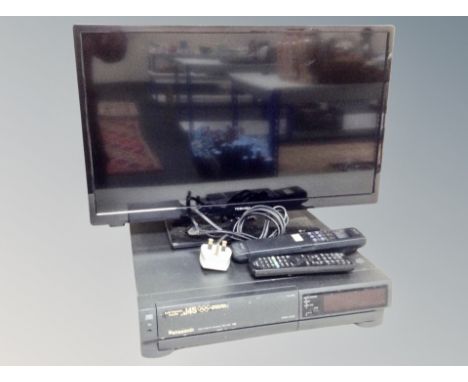 A Toshiba 24 inch LCD TV with lead and remote together with Panasonic video cassette recorder NV-J45 