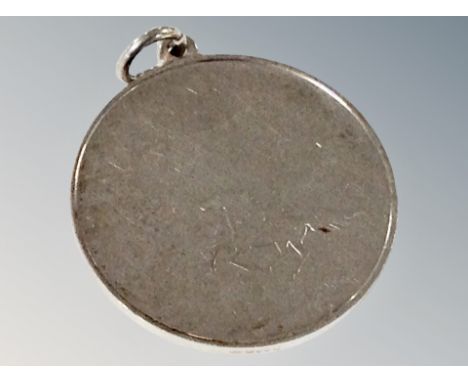 A silver pendant 