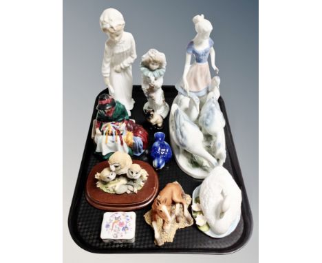 A Bavarian porcelain figure of a woman and geese, Nao figure of a boy, Nao clown, Leonardo collection figures etc 