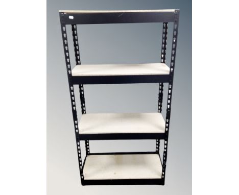 A four tier adjustable storage shelf, width 71 cm 