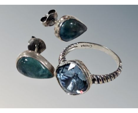 A silver ring and pair of earrings 