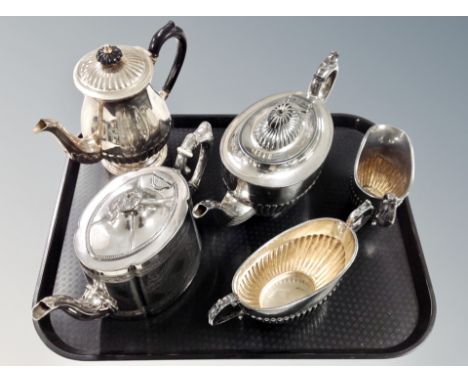 A silver plated three piece tea service and two further teapots 