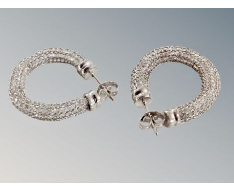 A pair of silver earrings 