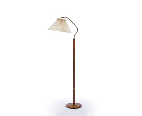 Manner of Kaare Klint (1888-1954) Floor lamp wood and brass with original shade 150cm high.