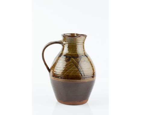 Michael Cardew (1901-1983) at Winchcombe Pottery Jug, circa 1928 slipware with brushed design over honey glaze impressed pott