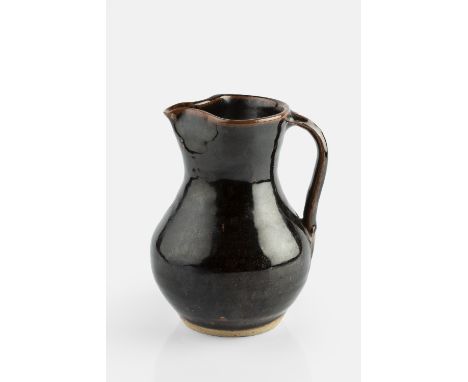 Ursula Mommens (1908-2010)  Jug tenmoku glaze impressed potter's seal 18cm high.