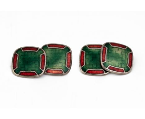 A PAIR OF RED AND GREEN ENAMEL CUFFLINKS Chain with square connector  C. 1920s 1.3 cm in diameter Condition: Some signs of we