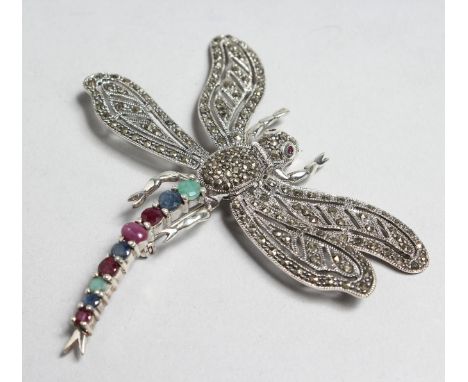 A LARGE SILVER, MARCASITE, EMERALD, SAPPHIRE AND RUBY DRAGONFLY BROOCH.