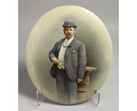 A VICTORIAN OVAL PORCELAIN PLAQUE. Portrait of a man, 14ins x 12ins.