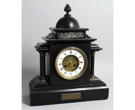 A VICTORIAN BLACK MARBLE FRENCH STRIKING MANTLE CLOCK with four columns, 15ins high, presented by Major L WAY.