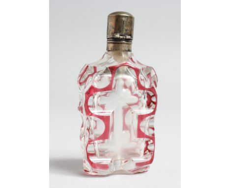 A CUT GLASS, RUBY TINTED SCENT BOTTLE WITH SILVER TOP, 3.5ins high.