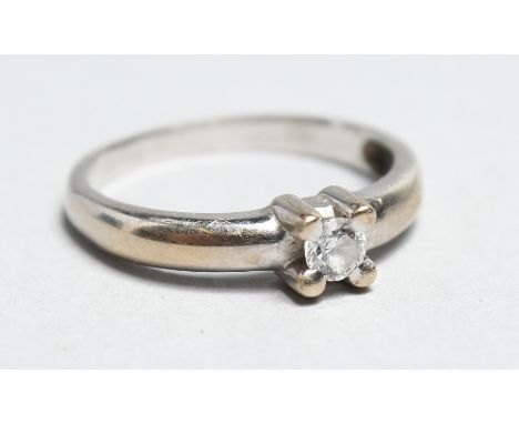 A 9CT WHITE GOLD SINGLE STONE DIAMOND RING.