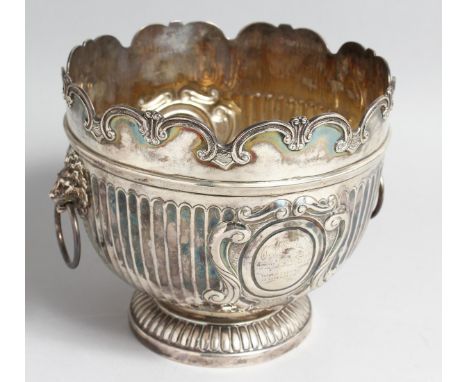 A VICTORIAN SILVER MONTEITH BOWL, semi fluted, with lion ring handles, London, 1896, makers, The Huttons, 7ins high, 8ins dia