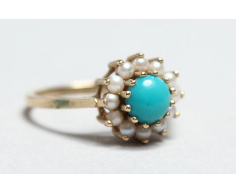 A 9CT GOLD TURQUOISE AND PEARL RING.