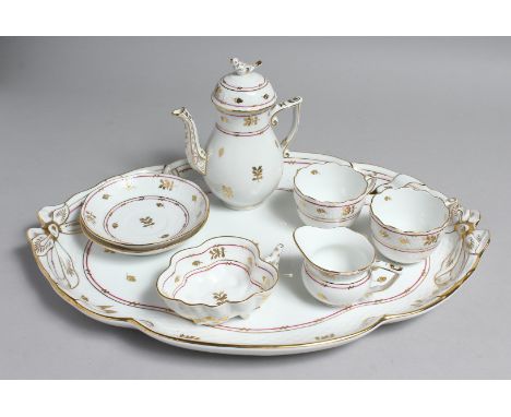 A GOOD HERANED CABERET, comprising of oval tray, two cups and saucers, milk jug, cream bowl and coffee pot.