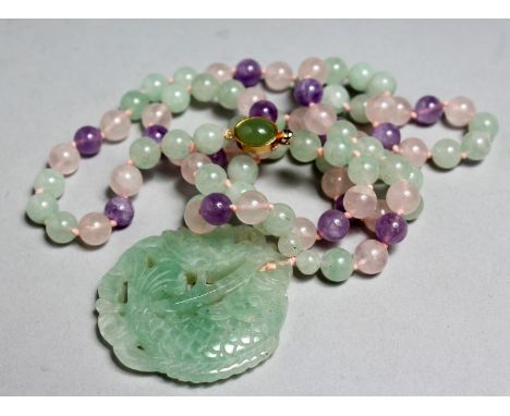 A CHINESE MULTI-COLOURED JADE NECKLACE with carved fish pendant, 30ins long.