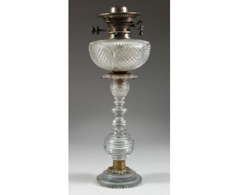 A GOOD CUT GLASS OIL LAMP 18ins high.