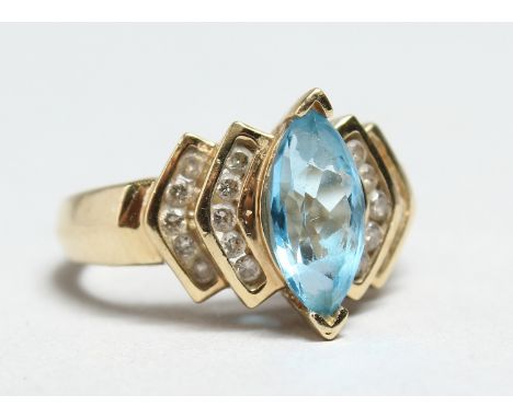 A 14CT GOLD, DIAMOND AND AQUAMARINE RING.