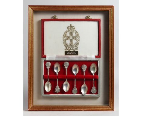 A CASED SET OF SIX SILVER TEA SPOONS WITH Q A R A M C. CREST ON THE HANDLE. 