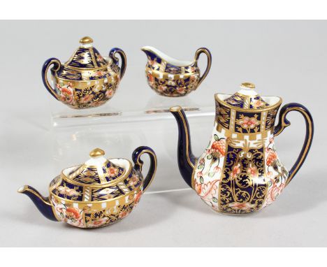 A MINIATURE CROWN DERBY PART SERVICE comprising teapot, coffee pot, sucrier and milk jug, teapot 3ins high.