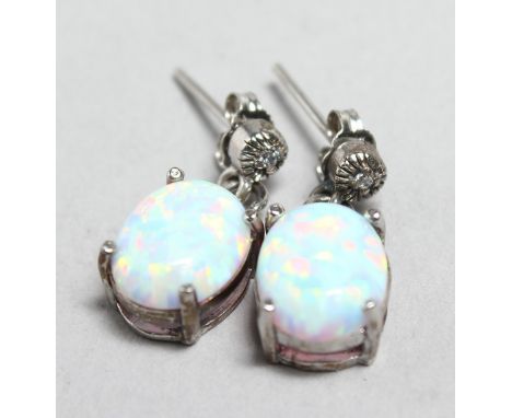 A PAIR OF SILVER AND OPAL EARRINGS.