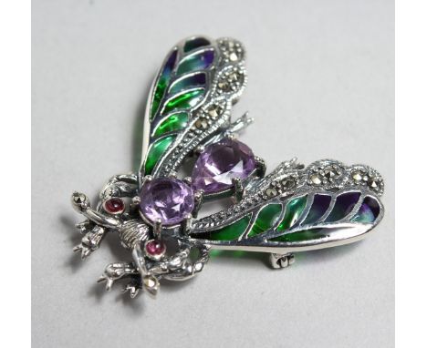 A SILVER AND AMETHYST BUG BROOCH.