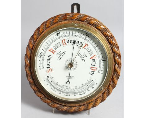 A GOOD OAK CASED CIRCULAR BAROMETER AND THERMOMETER by J. SEWILL, the dial 7.5ins.