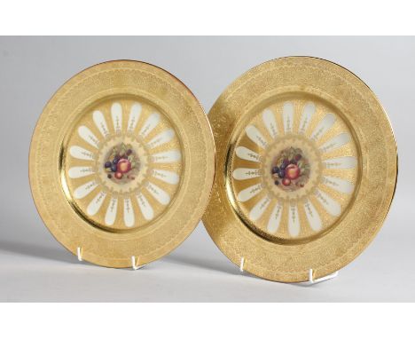A GOOD PAIR OF AYNSLEY FRUIT PLATES with gold borders. 10ins diameter.