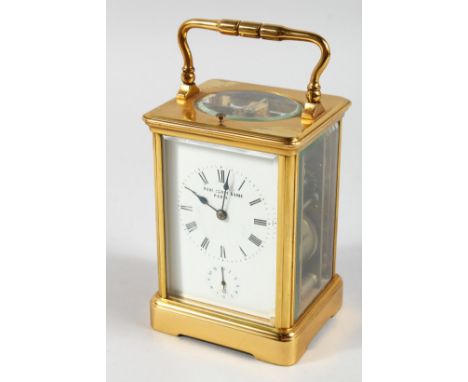 A FRENCH BRASS CARRIAGE CLOCK with eight day movement, striking on a gong enamel dial with subsidiary dial and repeat button,