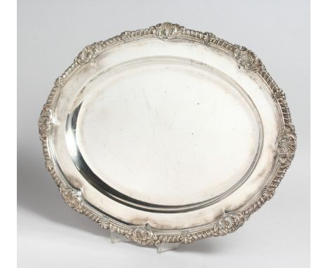 A GEORGE IV SILVER OVAL MEAT DISH with gadrooned and shell border, 17ins long. London 1823, maker R. S. Weight 41oz.