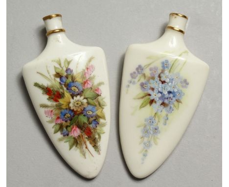 A 19TH CENTURY ROYAL WORCESTER PAIR OF SCENT BOTTLES painted with flowers, one with gold mark verso.