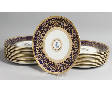  A SUPERB SET OF TWENTY THREE COALPORT PLATES with  A M D crest and fine blue and gold border.    