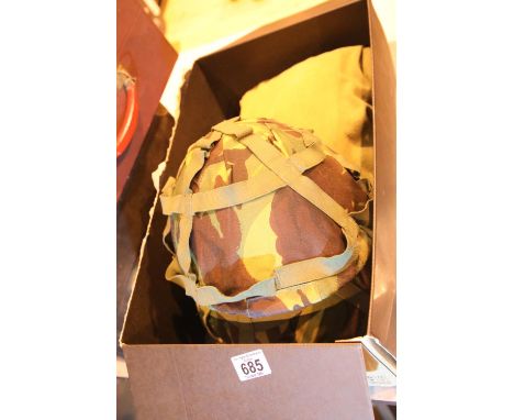 Two camouflage army helmets along with a mens extreme cold field shirt, 48" chest. Not available for in-house P&amp;P. 