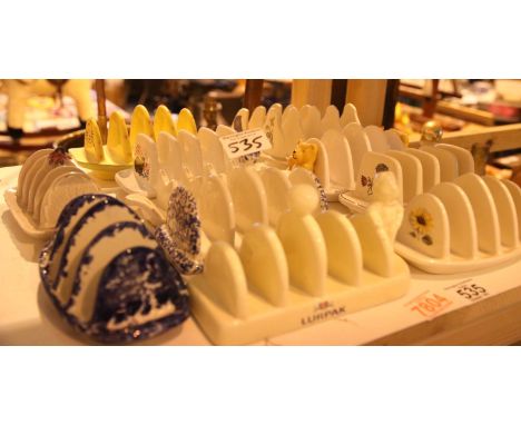 Twelve ceramic toast racks including Lurpak and Sadler. Not available for in-house P&amp;P. 