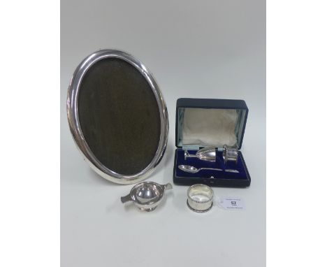 Mixed lot of early 20th century silver items to include egg cup, teaspoon, two napkin rings, oval mirror - 26cm high and a sm