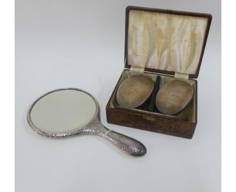 George V silver backed hand mirror, Birmingham 1912, together with a cased set of two Gents silver backed brushes and a comb,