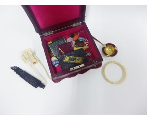 Late 19th / early 20th century red leather box containing  a variety of items to include a Scandinavia silver and enamel sift