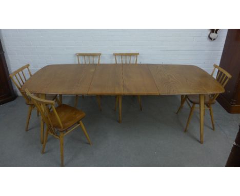 Ercol light elm and beech dining table and set of six stick back chairs (7) 225 (open) x 153 x (closed x 72 x 90cm 