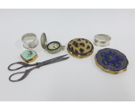 Mixed lot to include two silver napkin rings, pocket compass, two compacts, pill box and scissors, (a lot) 