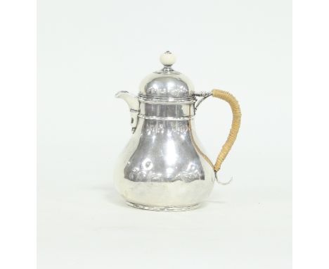 A Queen Anne style silver jug, marks obliterated and re-hallmarked LAO, London 2015, with domed hinged cover and bamboo bound