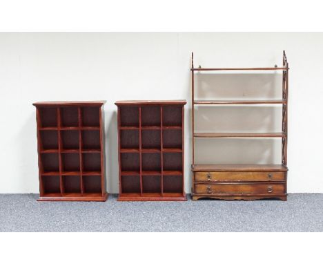 A pair of hanging shelves, each of twelve pigeon holes and another shelf with two drawers beneath, 68cm wide Condition Report