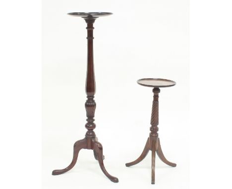 A mahogany jardinière stand, the circular top on an octagonal column support and tripod base, 106cm high and a smaller stand