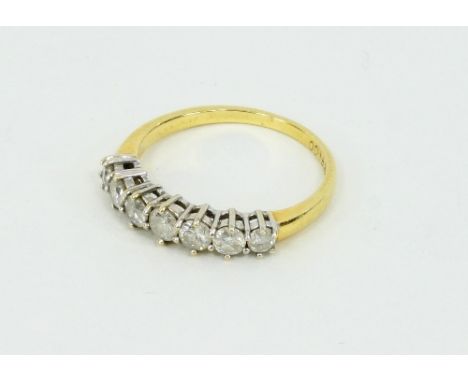 A diamond seven-stone ring set in gold