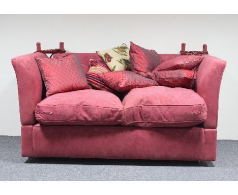 A Knole type sofa covered in crimson damask with loose seat and back cushions, 170cm wide