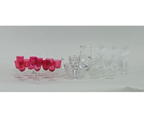 An Orrefors circular glass bowl, 16cm diameter, a Steuben glass bowl with stylised handle, twelve stem glasses with cranberry